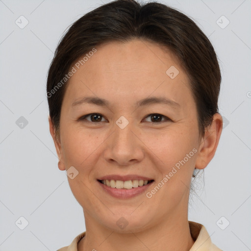 Joyful white adult female with short  brown hair and brown eyes