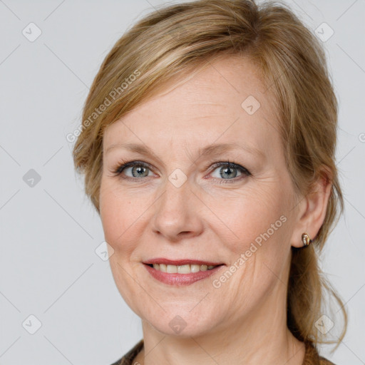 Joyful white adult female with medium  brown hair and grey eyes