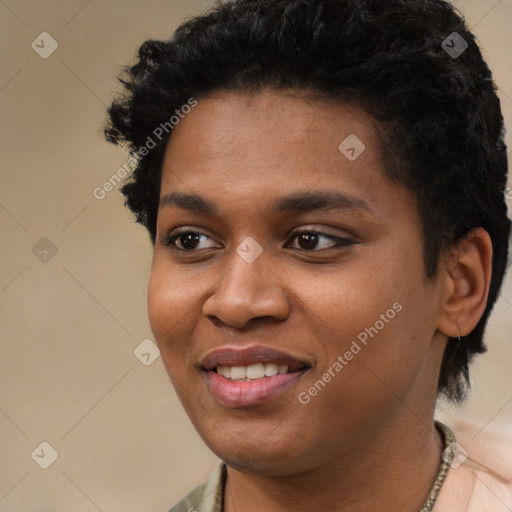 Joyful black young-adult female with short  black hair and brown eyes