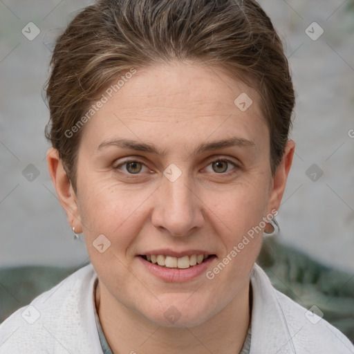 Joyful white adult female with short  brown hair and grey eyes