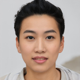 Joyful asian young-adult female with short  black hair and brown eyes