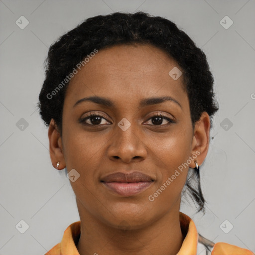 Joyful black young-adult female with short  brown hair and brown eyes