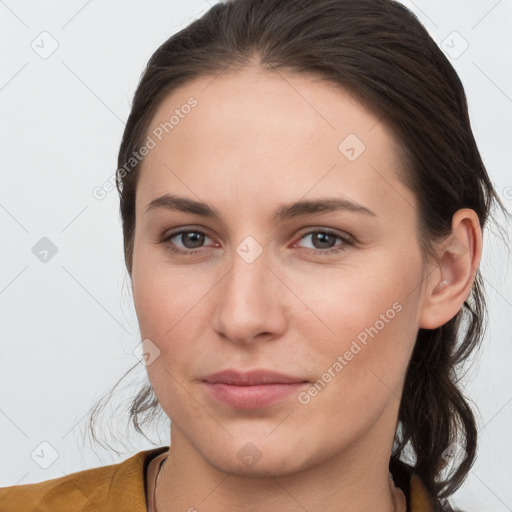 Joyful white young-adult female with long  brown hair and grey eyes