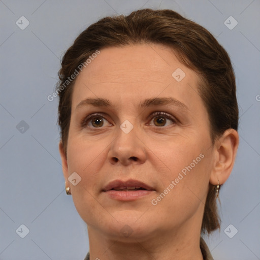 Joyful white adult female with short  brown hair and brown eyes