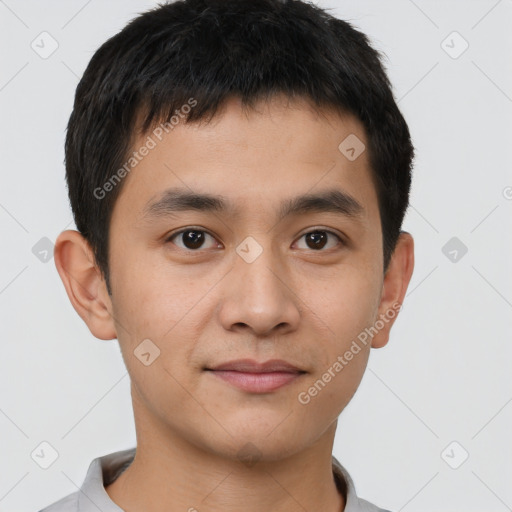 Joyful asian young-adult male with short  black hair and brown eyes