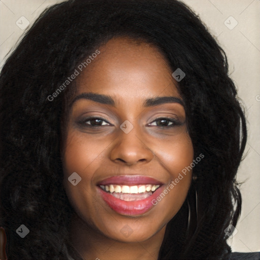 Joyful black young-adult female with long  brown hair and brown eyes