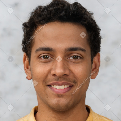 Joyful latino young-adult male with short  brown hair and brown eyes