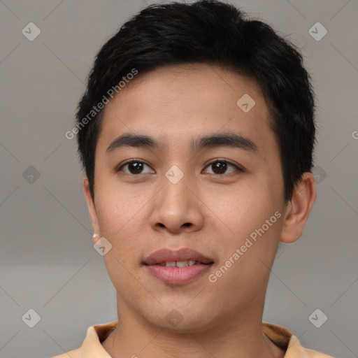 Joyful white young-adult male with short  black hair and brown eyes