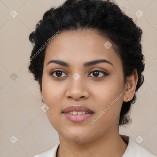 Joyful latino young-adult female with short  black hair and brown eyes