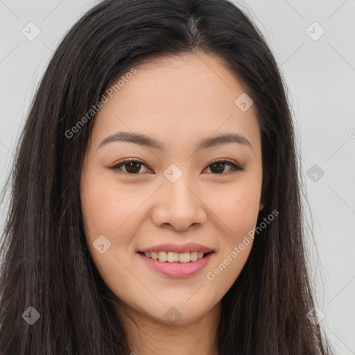 Joyful asian young-adult female with long  brown hair and brown eyes