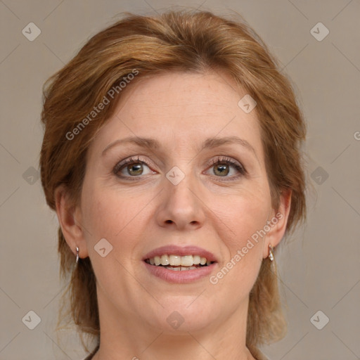 Joyful white adult female with medium  brown hair and blue eyes