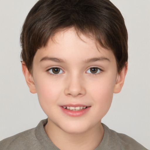 Joyful white child female with short  brown hair and brown eyes