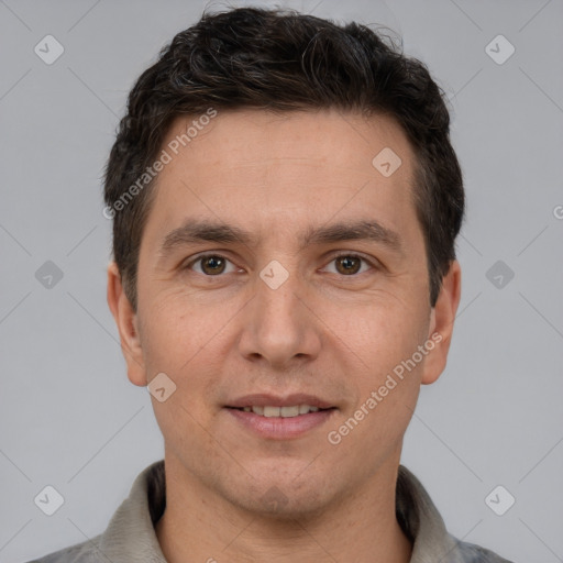 Joyful white adult male with short  brown hair and brown eyes