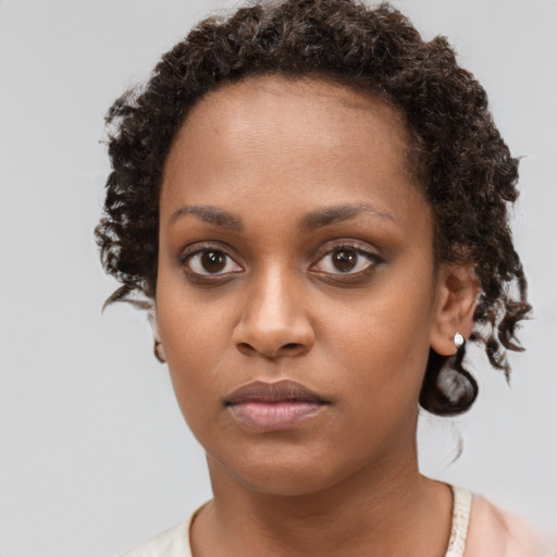 Neutral black young-adult female with short  brown hair and brown eyes