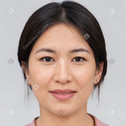 Joyful asian young-adult female with medium  brown hair and brown eyes