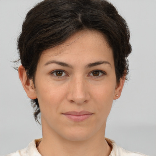 Joyful white young-adult female with short  brown hair and brown eyes