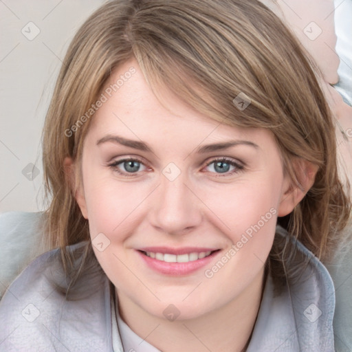 Joyful white young-adult female with medium  brown hair and blue eyes