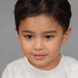 Joyful white child female with short  brown hair and brown eyes
