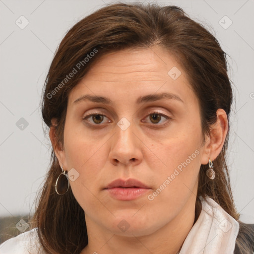 Joyful white adult female with medium  brown hair and brown eyes