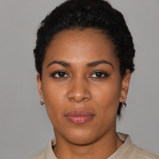 Neutral black young-adult female with short  black hair and brown eyes