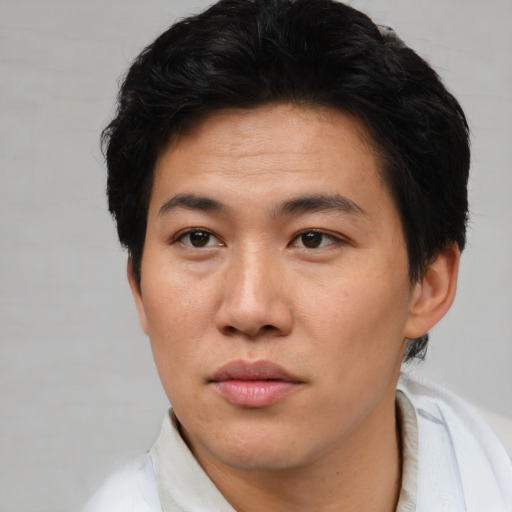 Neutral asian young-adult male with short  brown hair and brown eyes