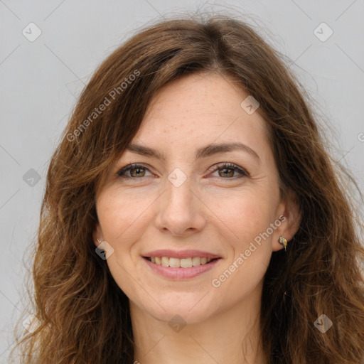 Joyful white adult female with long  brown hair and brown eyes
