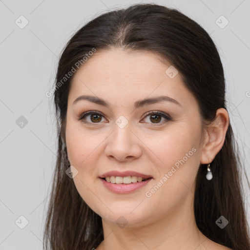 Joyful white young-adult female with long  brown hair and brown eyes