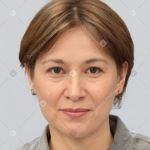 Joyful white adult female with medium  brown hair and grey eyes