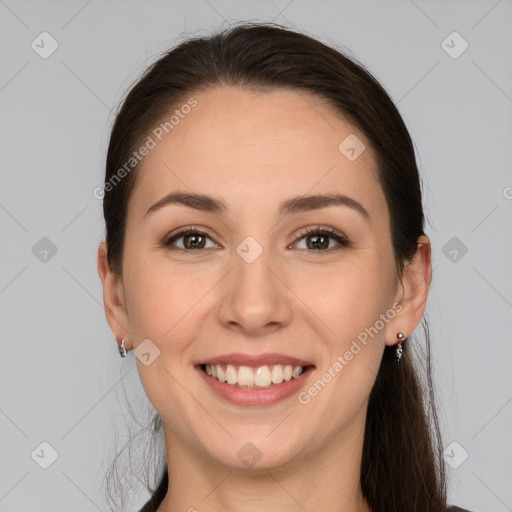 Joyful white young-adult female with long  brown hair and brown eyes