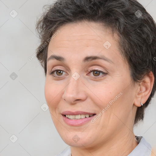 Joyful white adult female with short  brown hair and brown eyes