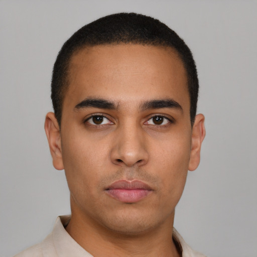 Neutral latino young-adult male with short  brown hair and brown eyes