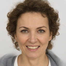 Joyful white adult female with short  brown hair and brown eyes