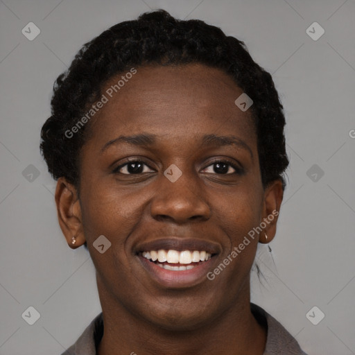 Joyful black young-adult female with short  brown hair and brown eyes