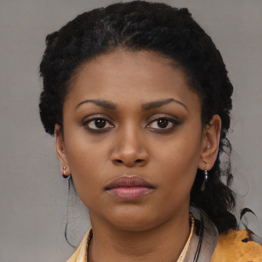 Neutral black young-adult female with long  black hair and brown eyes