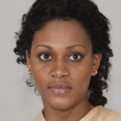 Neutral black young-adult female with short  brown hair and brown eyes