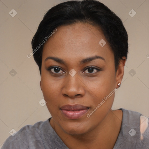 Joyful black young-adult female with short  black hair and brown eyes