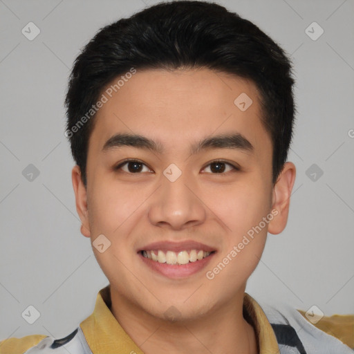 Joyful asian young-adult male with short  brown hair and brown eyes