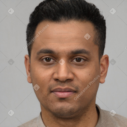 Joyful latino young-adult male with short  black hair and brown eyes