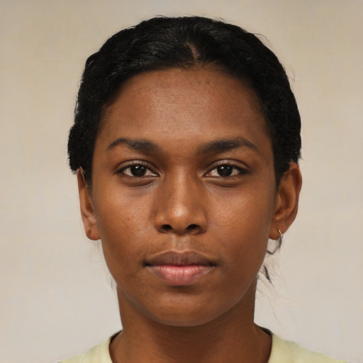Neutral black young-adult female with short  black hair and brown eyes