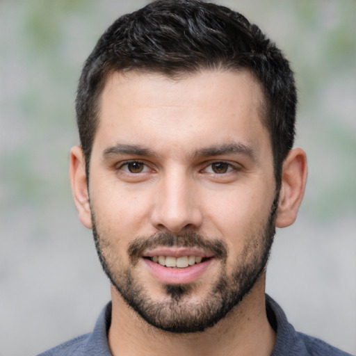 Joyful white young-adult male with short  brown hair and brown eyes