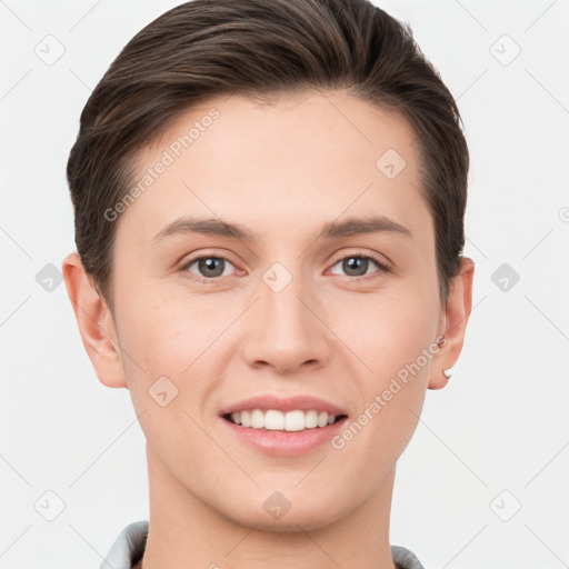 Joyful white young-adult female with short  brown hair and grey eyes