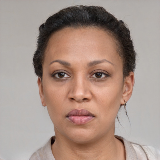 Neutral latino adult female with short  brown hair and brown eyes