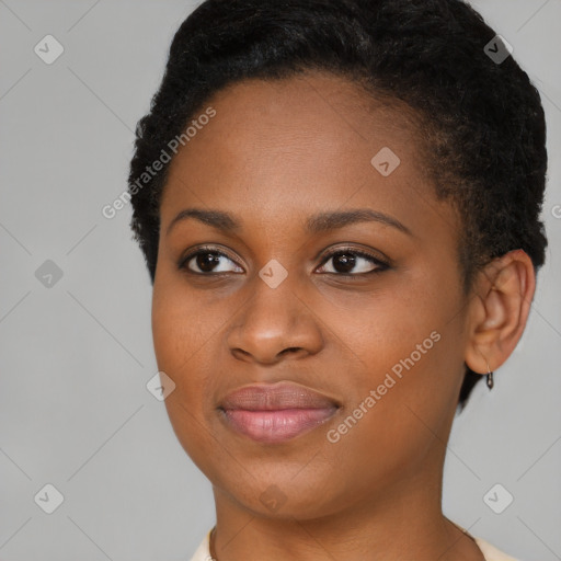 Joyful black young-adult female with short  brown hair and brown eyes