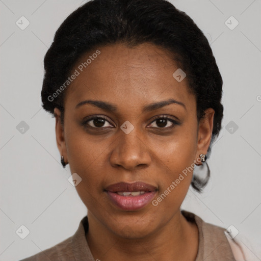 Joyful black adult female with short  black hair and brown eyes