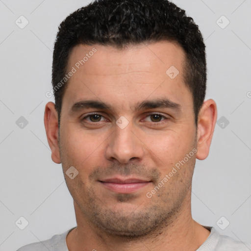 Joyful white young-adult male with short  black hair and brown eyes