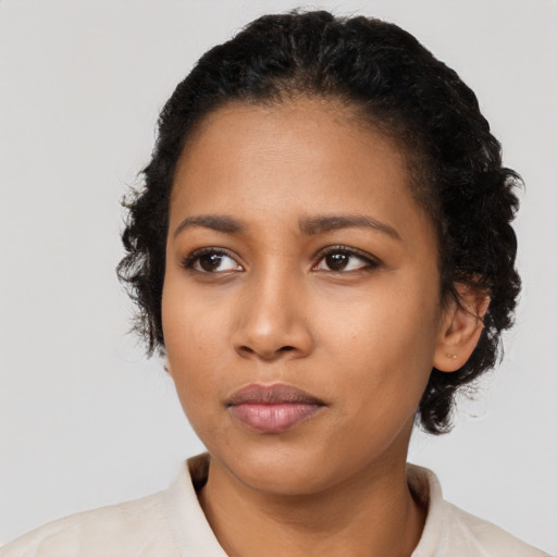 Neutral latino young-adult female with short  black hair and brown eyes
