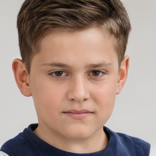 Joyful white child male with short  brown hair and brown eyes