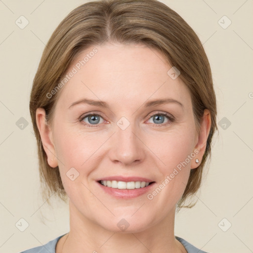 Joyful white young-adult female with medium  brown hair and blue eyes