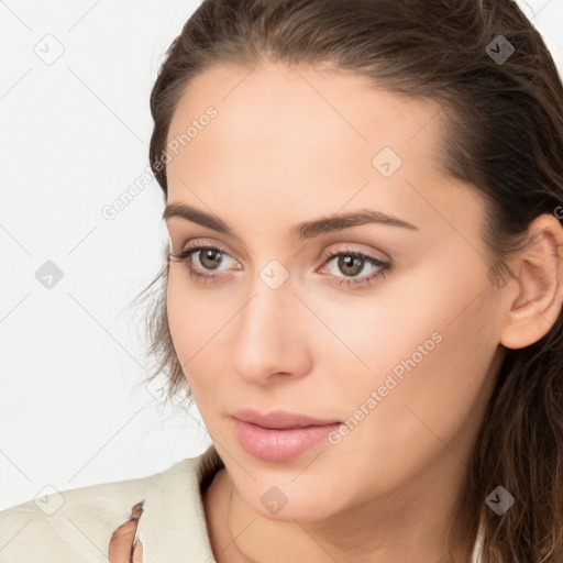 Neutral white young-adult female with long  brown hair and brown eyes