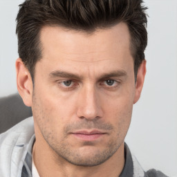 Neutral white adult male with short  brown hair and brown eyes
